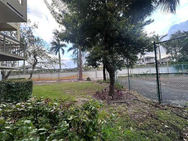 view of yard with fence and a water view