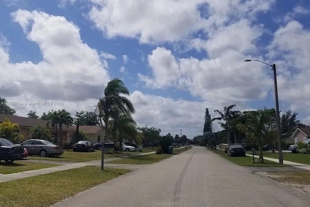 view of road with sidewalks and street lighting