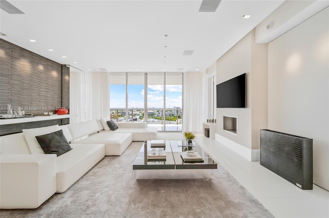 living room featuring recessed lighting and floor to ceiling windows