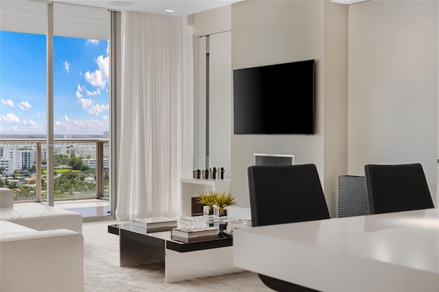 living area with floor to ceiling windows and a view of city