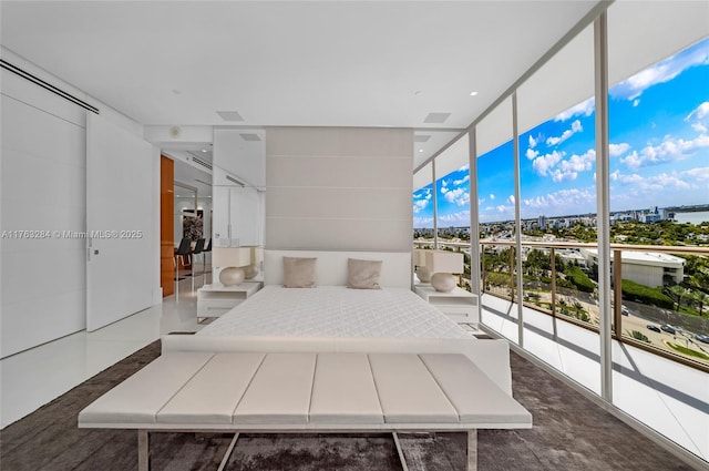 bedroom with floor to ceiling windows