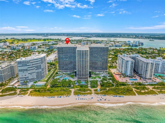 aerial view with a water view, a city view, and a beach view