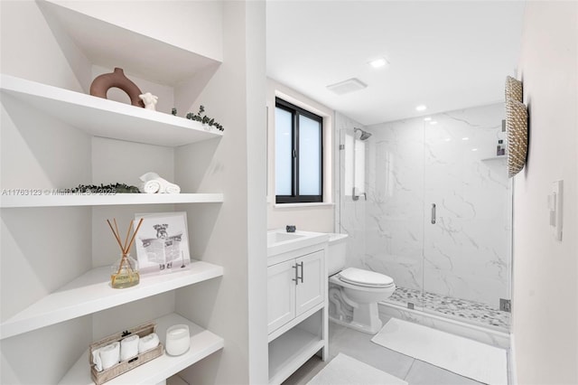 full bathroom featuring a marble finish shower, recessed lighting, toilet, and vanity