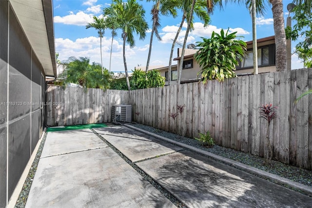 view of patio featuring central AC unit and a fenced backyard