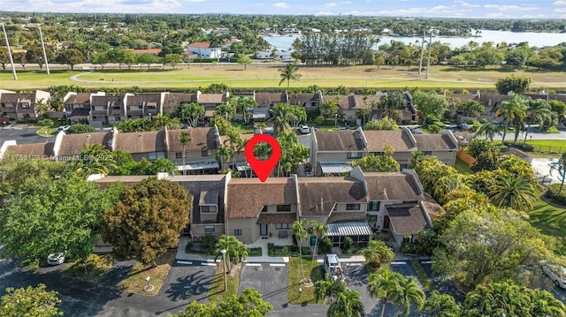 aerial view with a residential view and a water view