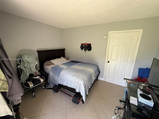 bedroom featuring tile patterned floors