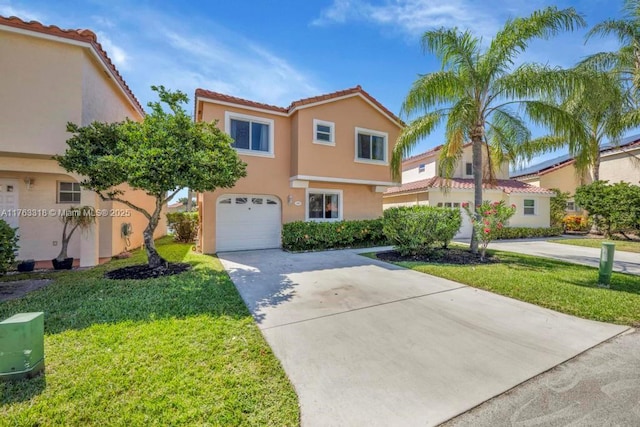 mediterranean / spanish home featuring a front yard, an attached garage, stucco siding, concrete driveway, and a tile roof