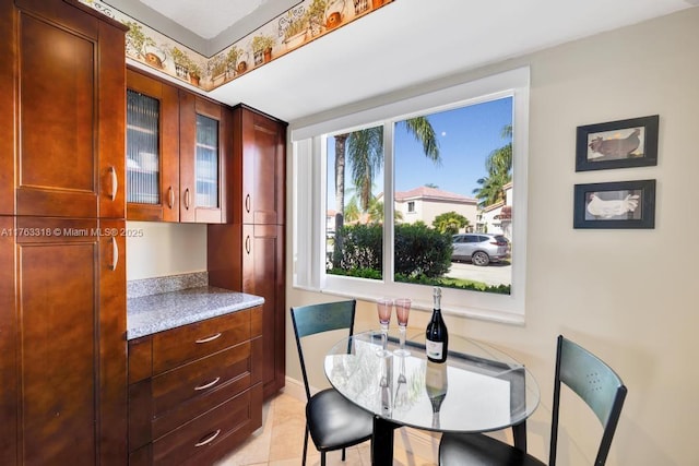 dining area featuring light tile patterned floors