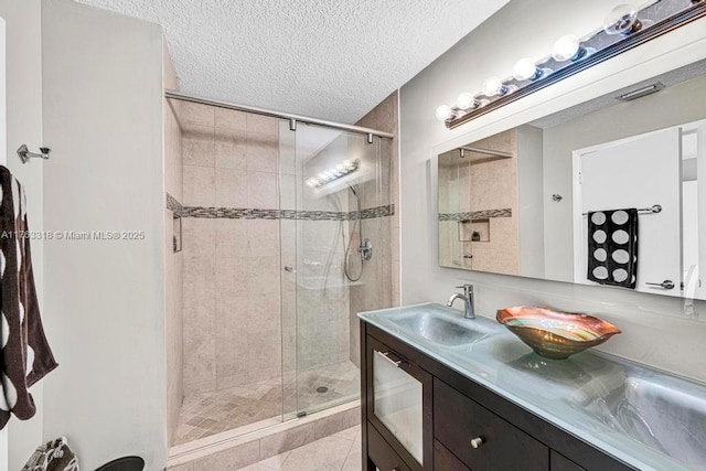 1091 SE 6th Ave, Dania Beach, FL 33004 - full bathroom with a shower stall, tile patterned flooring, vanity, and a textured ceiling