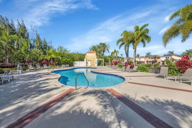 pool featuring a patio and fence