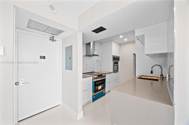 20379 W Country Club Dr Unit 1938, Aventura, FL 33180 - kitchen with modern cabinets, a sink, electric panel, stainless steel appliances, and wall chimney range hood