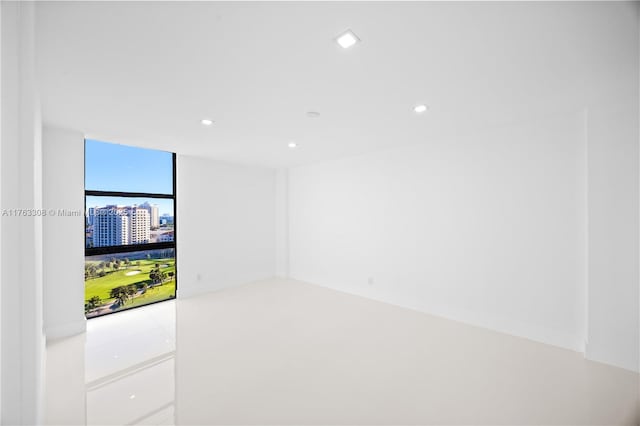 20379 W Country Club Dr Unit 1938, Aventura, FL 33180 - spare room featuring a wall of windows, a view of city, and recessed lighting