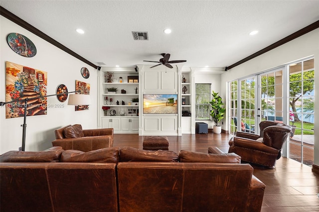 living room featuring ornamental molding, french doors, ceiling fan, and visible vents