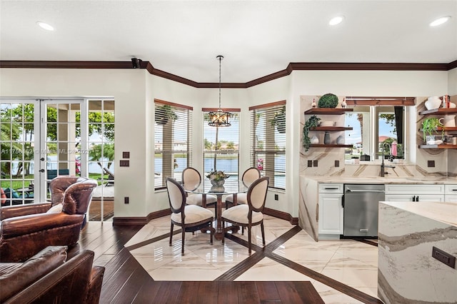 dining room featuring crown molding, baseboards, a chandelier, recessed lighting, and french doors