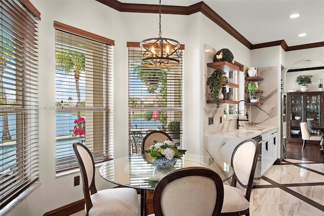 dining area with ornamental molding, marble finish floor, baseboards, recessed lighting, and a notable chandelier