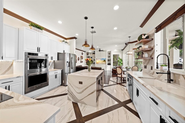 kitchen featuring recessed lighting, appliances with stainless steel finishes, open shelves, and a sink