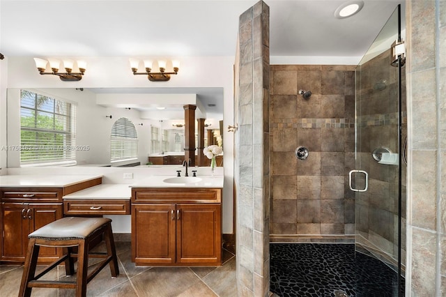 bathroom featuring vanity, tile patterned flooring, and a shower stall