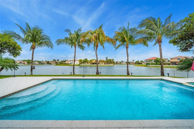 outdoor pool featuring a water view