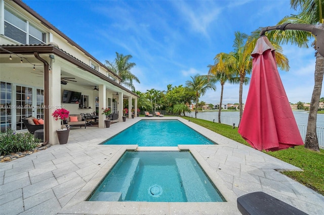 view of swimming pool featuring french doors, a ceiling fan, a patio, and a pool with connected hot tub