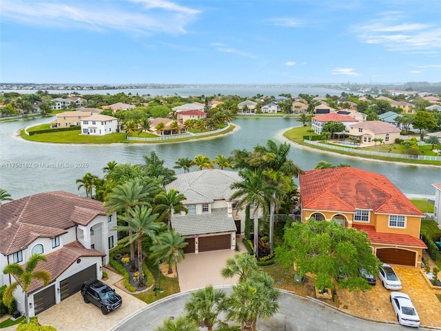 bird's eye view featuring a residential view and a water view