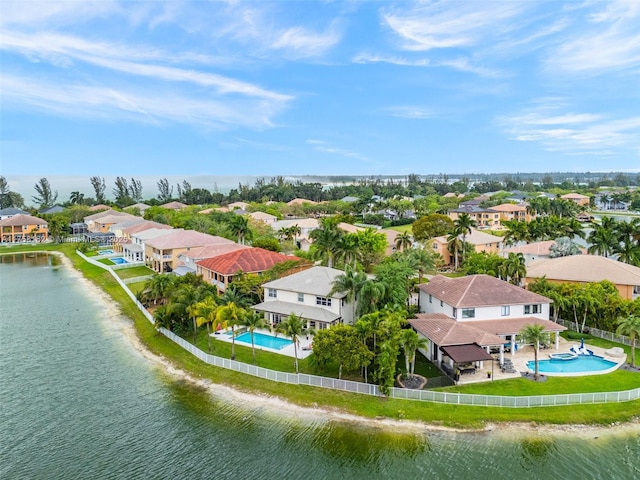 bird's eye view featuring a residential view and a water view