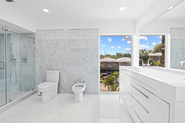 full bathroom featuring toilet, a bidet, recessed lighting, a stall shower, and vanity