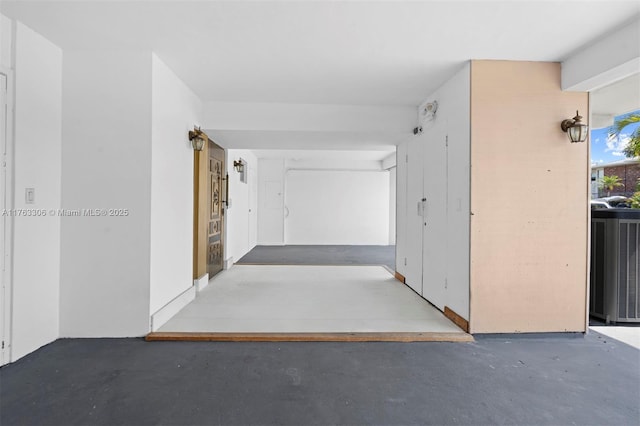 hall with concrete floors