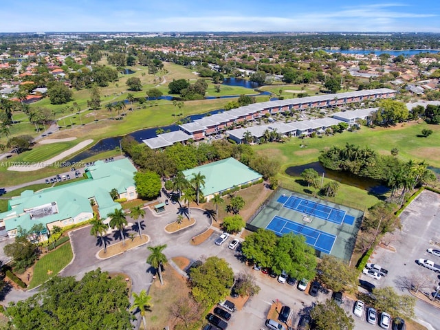 bird's eye view featuring a water view and view of golf course