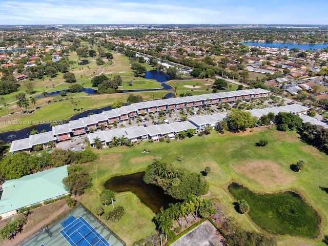 birds eye view of property with a residential view, golf course view, and a water view