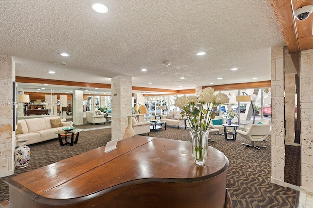 dining area with carpet flooring, recessed lighting, a textured ceiling, and decorative columns