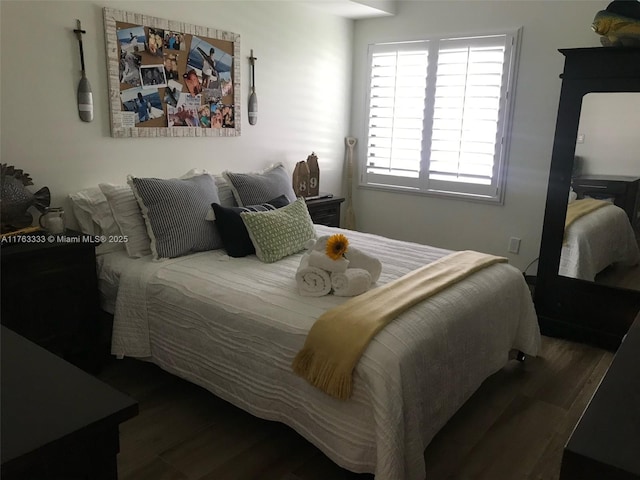 bedroom with wood finished floors