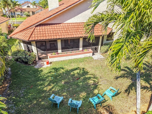 view of yard with a sunroom