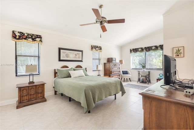 bedroom featuring baseboards, ceiling fan, light tile patterned flooring, and vaulted ceiling