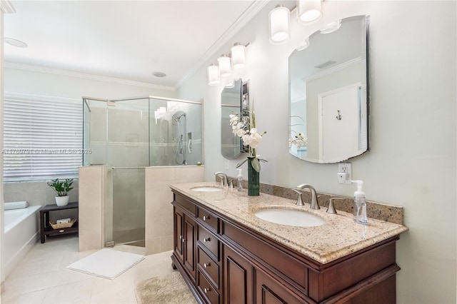 bathroom featuring crown molding, a garden tub, a stall shower, and a sink