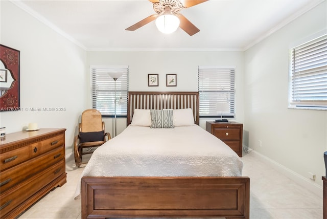 bedroom featuring crown molding, a ceiling fan, and baseboards