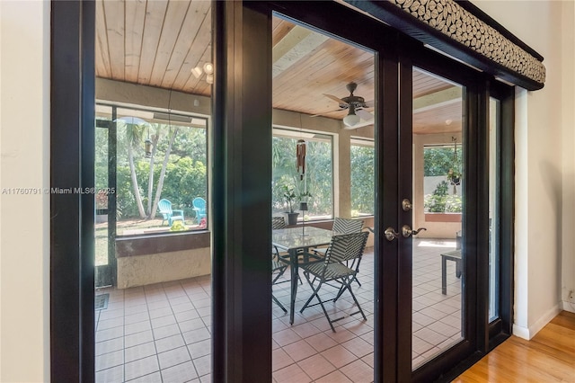 doorway to outside with a healthy amount of sunlight, french doors, wooden ceiling, and a ceiling fan