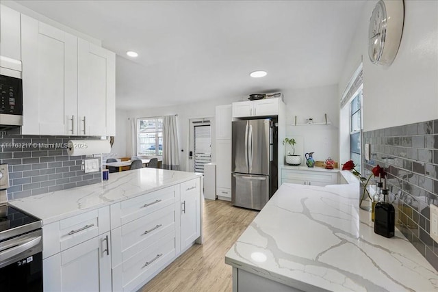 1 Keswick A 1, Deerfield Beach, FL 33442 - kitchen featuring stainless steel appliances, white cabinetry, backsplash, light stone countertops, and recessed lighting