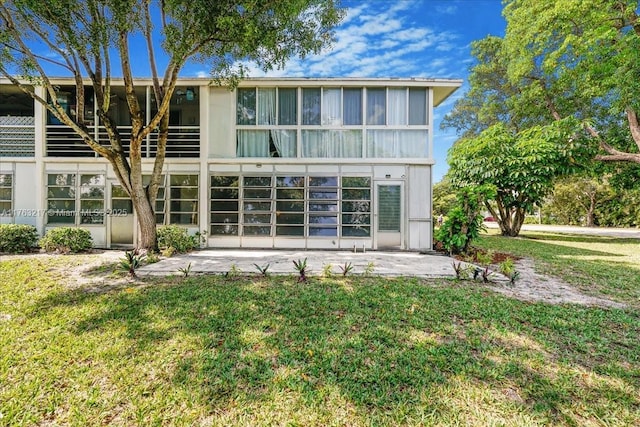 1 Keswick A 1, Deerfield Beach, FL 33442 - back of house with a lawn