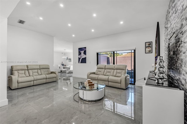 living room with baseboards, visible vents, recessed lighting, and marble finish floor