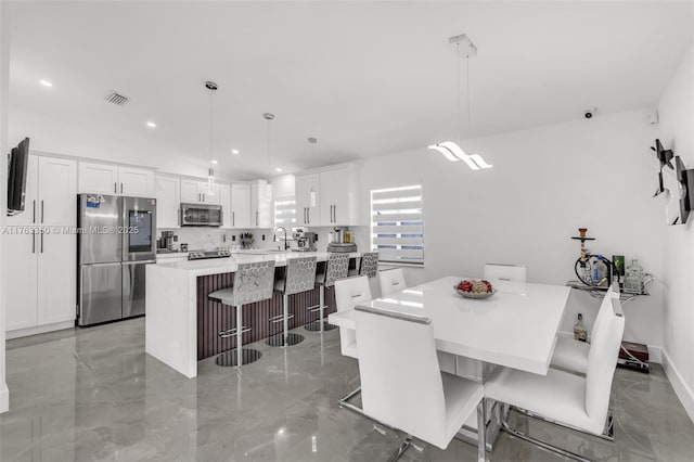 dining area with visible vents, recessed lighting, and marble finish floor