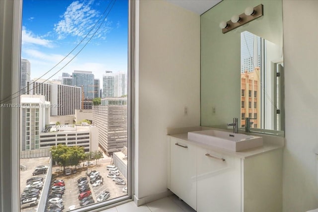 151 SE 1st St Unit 1011, Miami, FL 33131 - bathroom featuring a view of city and vanity