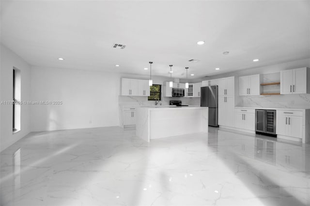 kitchen with beverage cooler, visible vents, open shelves, freestanding refrigerator, and marble finish floor