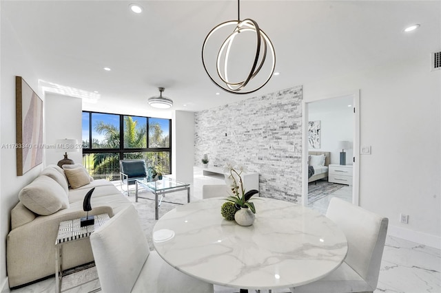 dining area with visible vents, baseboards, floor to ceiling windows, recessed lighting, and marble finish floor