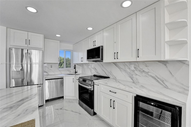 kitchen featuring open shelves, a sink, white cabinetry, wine cooler, and appliances with stainless steel finishes