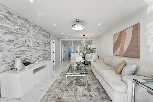 living room with marble finish floor and recessed lighting