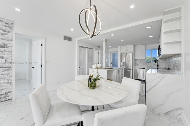 dining space featuring marble finish floor, recessed lighting, and visible vents