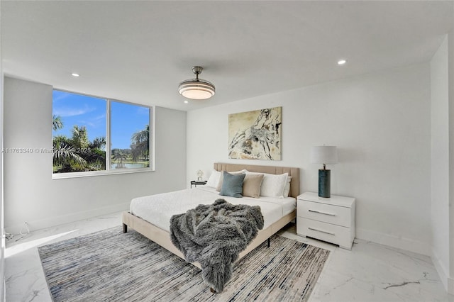 bedroom featuring marble finish floor, baseboards, and recessed lighting