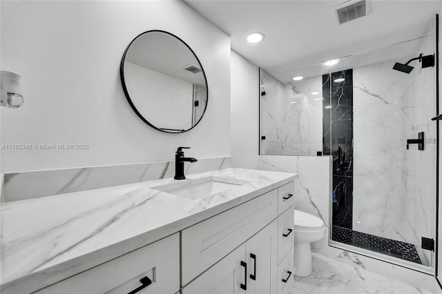 full bath featuring a marble finish shower, visible vents, toilet, marble finish floor, and vanity