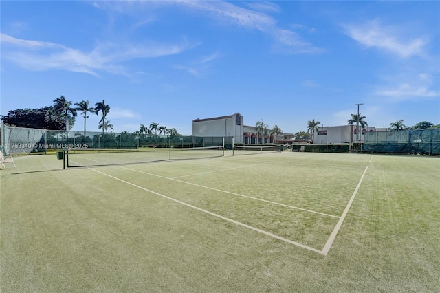 view of sport court featuring fence