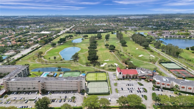 drone / aerial view featuring a water view and golf course view